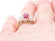 Ruby Cabochon Ring with Diamonds on finger