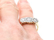 Trilogy Cluster Ring in Yellow Gold on finger