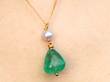 GIA Certified Emerald Pendant being worn