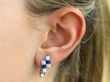 Art Deco Platinum Diamond & Sapphire Earring in ear