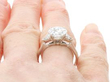 2.14 Carat Diamond Solitaire Ring with Trillion Side Stones on hand