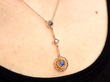 Edwardian Sapphire Pendant Necklace in Gold being worn