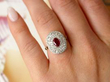 Wearing Oval Cut Ruby Ring with Double Diamond Halo