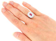 Wearing Oval Ruby and Diamond Halo ring