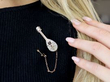 wearing a mandolin brooch