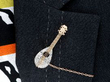 wearing Victorian mandolin brooch
