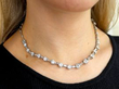 round and baguette cut diamond necklace on neck