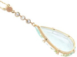 pear cut aquamarine pendant with yellow gold setting