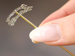 holding pig pin brooch
