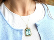 aquamarine gold pendant being worn