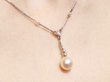 1920s Pearl Drop Necklace with Diamonds being worn