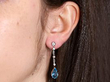 Antique aquamarine and diamond earring being worn