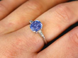 Blue Ceylon sapphire and platinum Engagement Ring on finger
