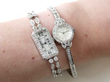 diamond watches stacked on wrist