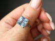 Cushion Cut Cornflower Sapphire Engagement Ring in Platinum on thumb