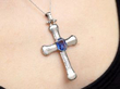 wearing Vintage Sapphire Cross Pendant in Platinum