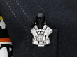 diamond dyed quartz palladium brooch being worn