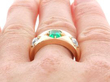 Emerald and Diamond Gold Band on finger
