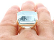 Gold Emerald Cut Aquamarine Ring on finger