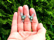 Garrard Emerald and Diamond earrings outside