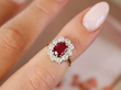 Cushion Cut Ruby and Diamond Cluster Ring on finger