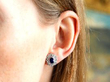 sapphire diamond white gold cluster earring in ear