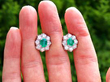 Oval Cut Emerald Cluster Earrings outside