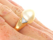 Gold Cultured Pearl and Diamond Ring on hand