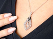 wearing Black Onyx and Diamond Pendant in Platinum