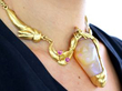 wearing Carved Opal and Ruby Necklace in 18ct Gold