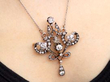 wearing Edwardian Diamond pendant in Yellow Gold