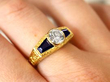 Gold Bezel Set Diamond Ring with Sapphires on finger