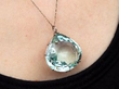 wearing 43.78 Carat Aquamarine Pendant in Platinum