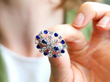 Holding Circular Sapphire Brooch