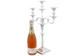 Tall Sterling Silver Candelabra next to bottle