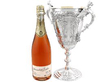 Solid Silver Presentation Cup with Handles next to a bottle
