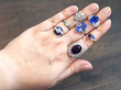 gemstone rings on hand