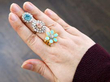 gemstone rings stacked on finger