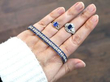 sapphire rings and bracelet on hand