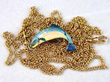 gold chains and fish brooch