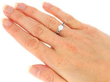Solitaire Ring with Sapphire and Diamond Shoulders being worn