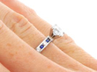 Solitaire Ring with Sapphire and Diamond Shoulders on finger
