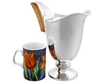 Solid Silver Water Jug next to a mug