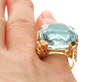 Cushion Cut Aquamarine Ring in Yellow Gold on finger