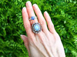 gemstone rings stacked on finger