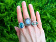 gemstone rings outside on hand