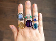 gemstone rings on hand