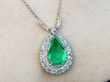 Antique Pear Cut Emerald Pendant being worn