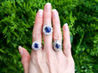 sapphire rings on hand outside