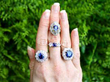 sapphire rings on hand outside